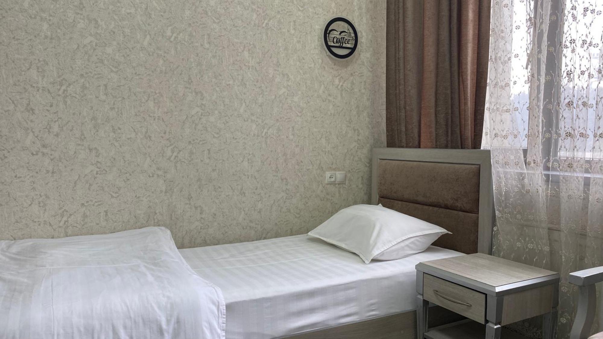Diyor Hotel Marghilon Exterior foto